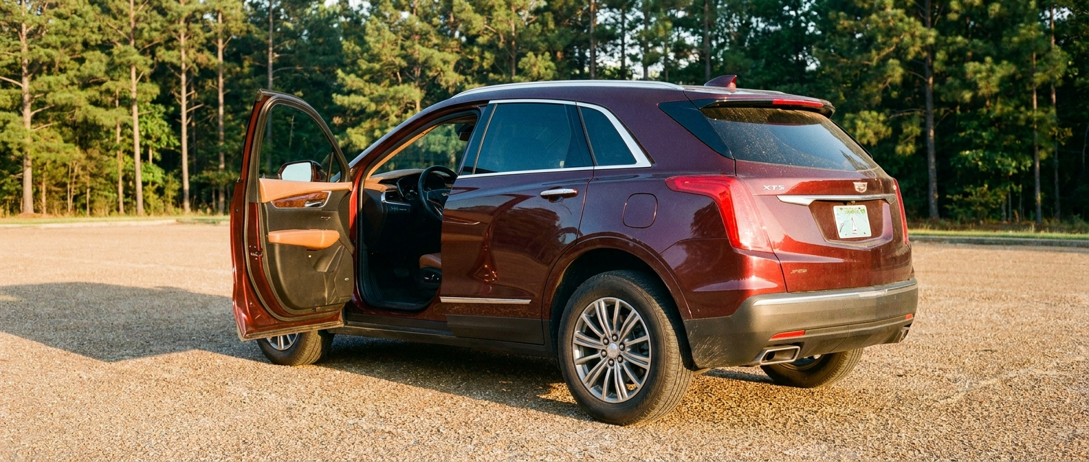 Pre-owned Cadillac XT5 on a Mississippi lot near Pearl, interior showing quilted leather and infotainment display